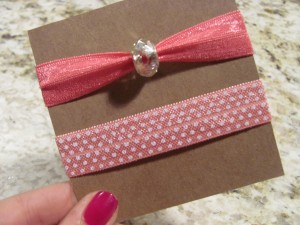 Pink soft elastic hair ties, one with polka dot print