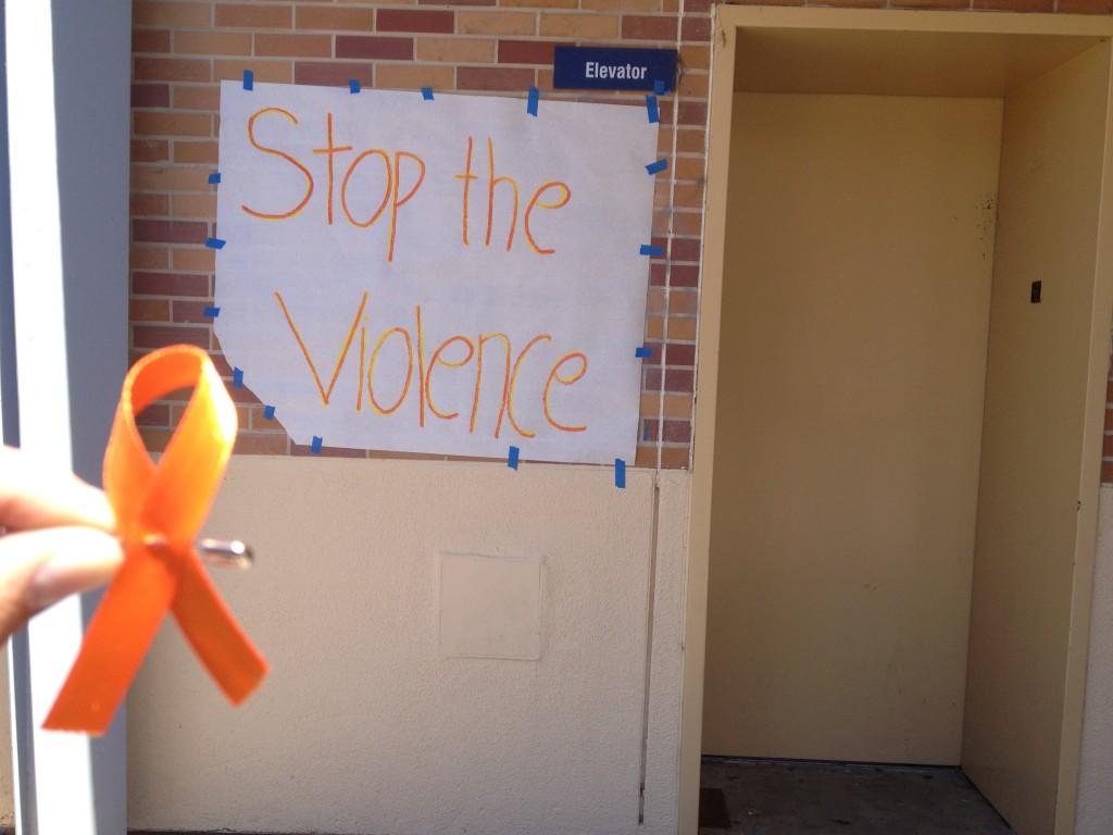 Posters were hung up and orange ribbons were passed out to support the ending of violence.