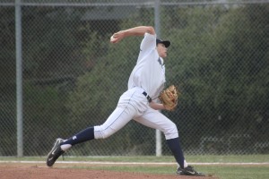 Senior Greg Hubbell pitching against the Cougars