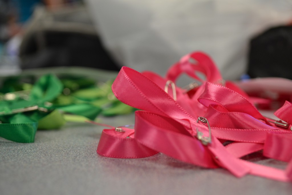 The pink ribbons for cancer will be handed out on Monday to promote awareness.