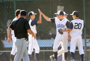 Sophomores Bobby Lyon and Joe Pratt high five after earning a win