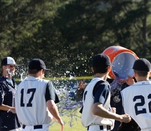 Members of the team celebrate the win by dumping the cooler on head coach Chris Davidson