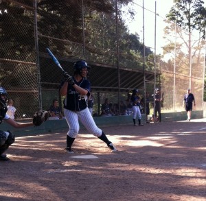 Loucks braces herself at bat for the oncoming pitch