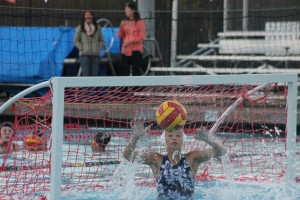 Goalie Sina Gomez blocks a shot from Burlingame High School. 