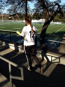 Junior Brittany Zelnik Takes the field binder in hand,