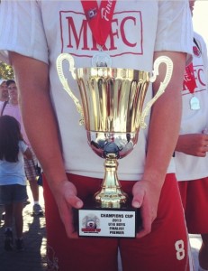 Bran showing his championship trophy for his club team Madera Roja Real Madrid.