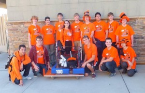 Team 100 Wildhats displays one of their finished robots, built by hand.