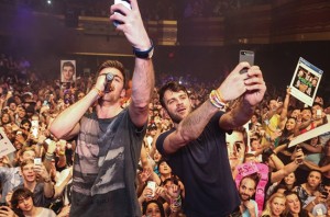 The Chainsmokers take a selfie while performing their hit song "#SELFIE."