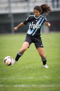Action shot of Fong taken for her club soccer team, De Anza Force.